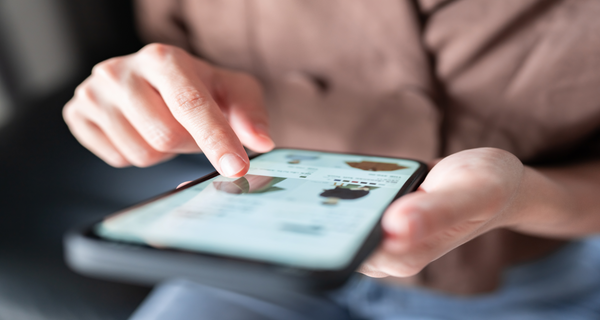 Person using a smartphone with a blurred background